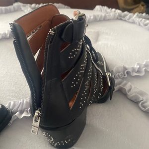 Black sexy Coach booties with silver studs and zipper up back!! Worn once!!